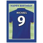 Personalised Blue Football Shirt Birthday Card with Name and Number on Pitch Background