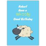 Personalised Woolly Good Birthday Pun Card with Cute Cartoon Sheep on Blue Background
